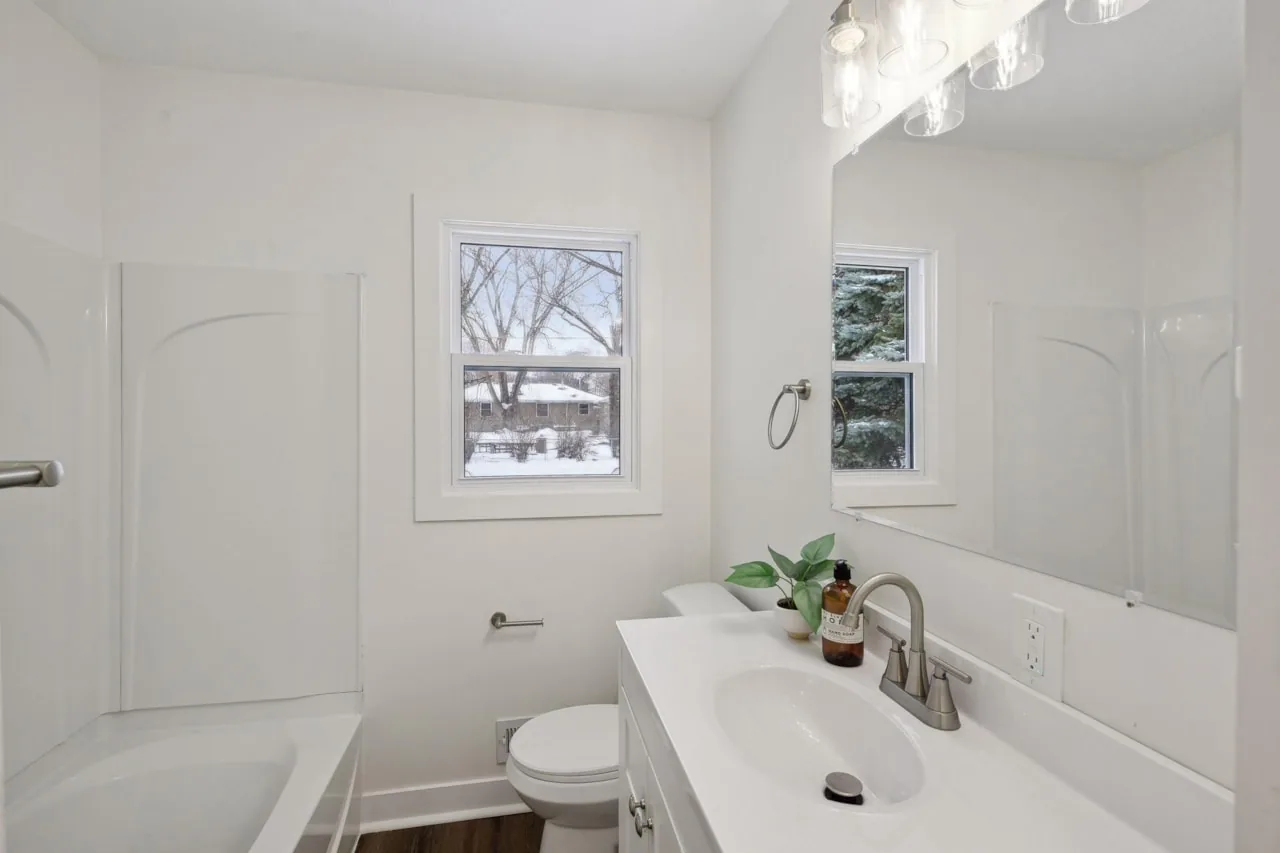 New full bathroom with tub and vanity