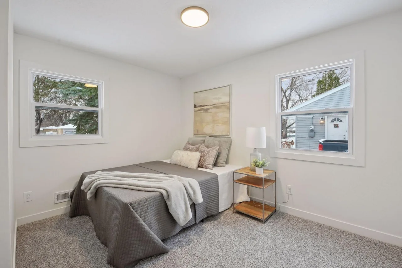 Bedroom rebuilt with new carpet, windows and trim
