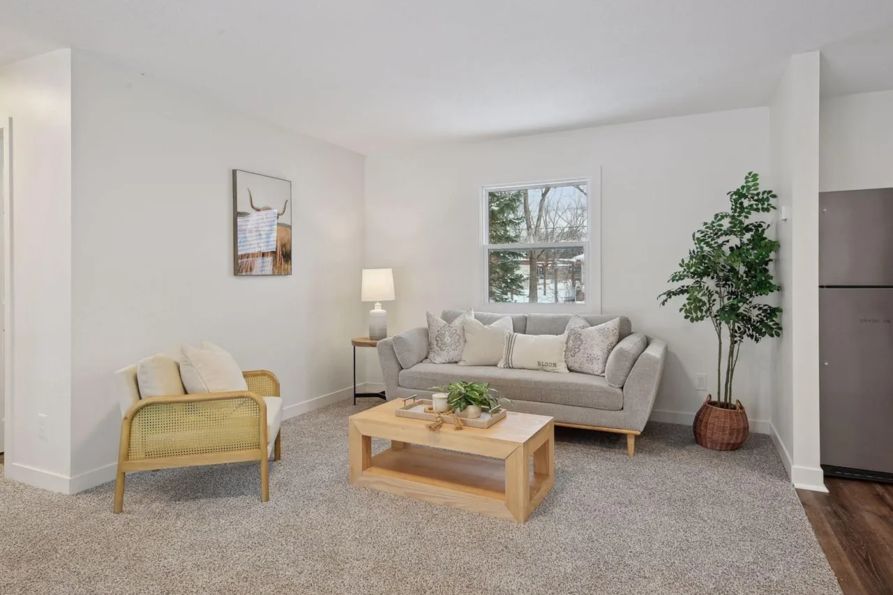 Living room with new flooring, trim and paint